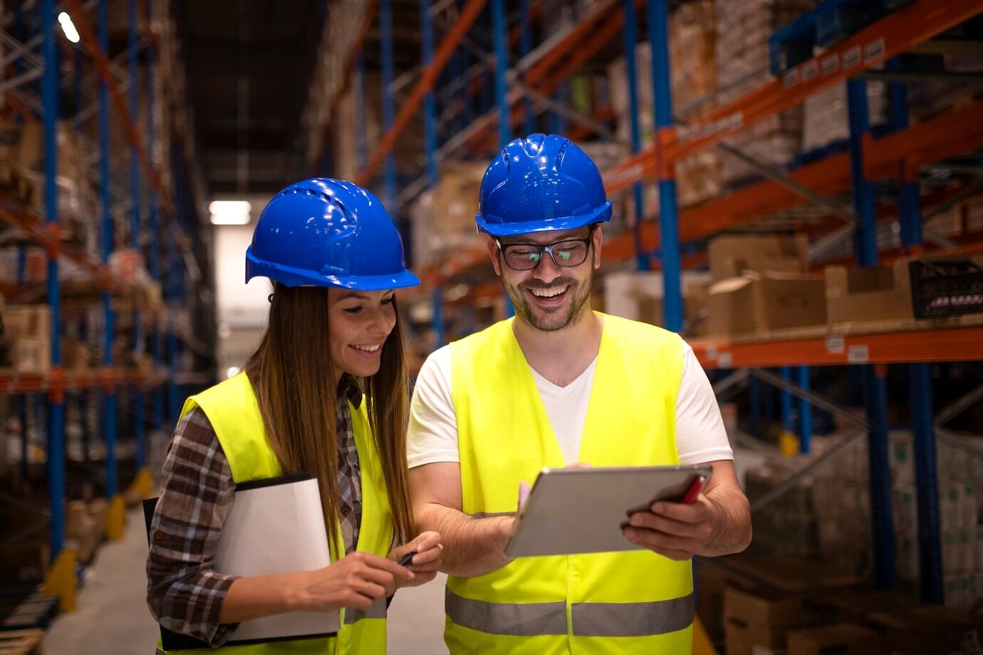 warehouse-workers-checking-shipment-status-tablet-computer_342744-1531